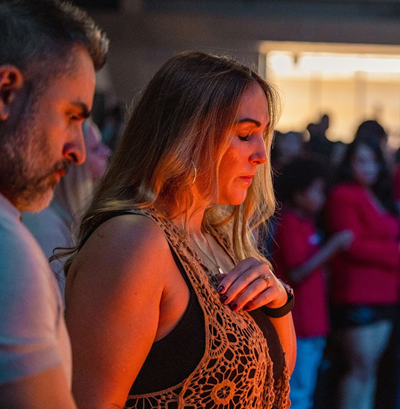 Eastlake attendees gazing into the fire during moment of silence